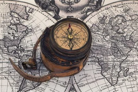 Ancient compass on the world map. Stock Photos