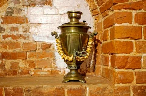 Ancient copper samovar stands in the form of decorations with lamb products o Stock Photos
