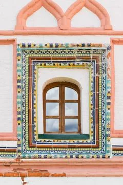 Ancient decorated wall with arched window, background photo texture Stock Photos