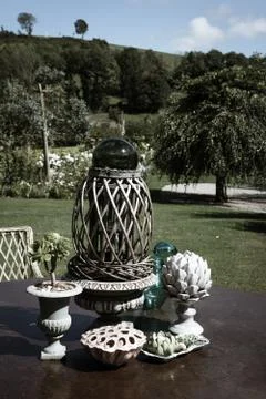 Ancient decorative objects in the garden insummer Stock Photos