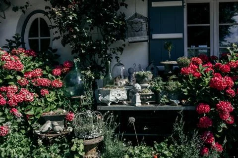 Ancient decorative objects in the garden insummer Stock Photos