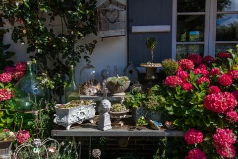 Ancient decorative objects in the garden insummer Stock Photos