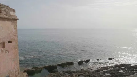 Ancient defensive tower of a seaside town Video stock 232437068