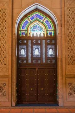 Ancient door in the mosque with patterns and ornaments Stock Photos