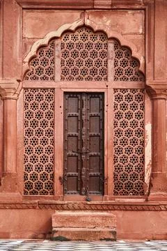 Ancient door with wall decorative elements of Taj Mahal, ancient wall decor.. Stock Photos