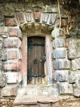 Ancient door in the wall. Stock Photos