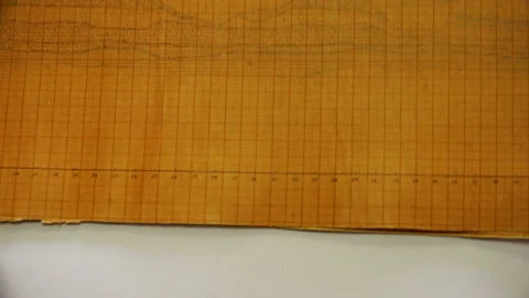 Ancient drawings on the scale-coordinate paper Stock Footage 93442703