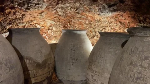 Ancient earthenware jars for storing wine in a cave in a Spanish village Video stock 302947202
