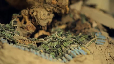 Ancient egyptian mummy faience bead net collar detail Stock Footage 336752041
