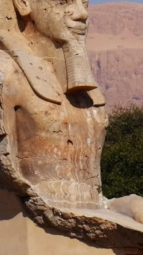Ancient Egyptian pharaoh statue with royal headdress and hieroglyphs against Stock Footage 337501295