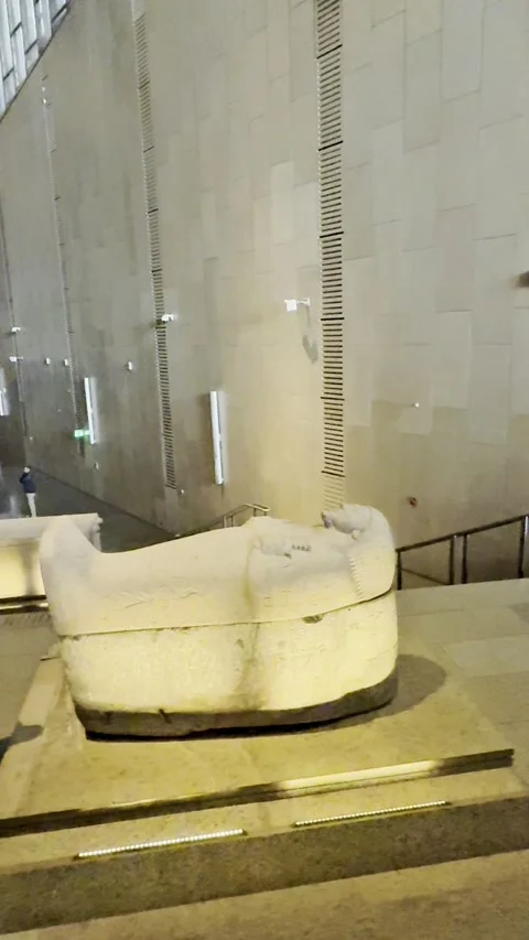 Ancient Egyptian sarcophagus displayed inside the Grand Egyptian Museum Stock Footage 335030323