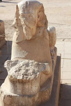Ancient Egyptian sphinx statue with half damaged face Stock Photos
