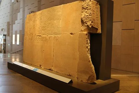 Ancient Egyptian stone slab with partial hieroglyph inscriptions Stock Photos