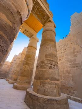 Ancient Egyptian temple columns featuring  detailed hieroglyphics Stock Photos