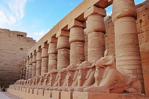 Ancient Egyptian temple featuring rows of ram statues Stock Photos