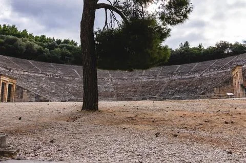Ancient Epidaurus Theater with tree in foreground. Stock Photos