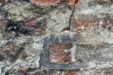 Ancient European stone wall forms textured background plate Foto stock