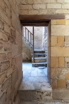 Ancient external bricks stone wall and doorway revealing a stone staircase Stock Photos