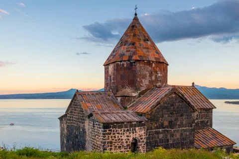Ancient famous monastery Sevanavank at sunset, view of Lake Sevan, Armenia Stock Photos