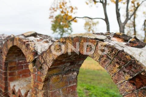 Ancient figured brick masonry. Fencing in the Rukavishnikov manor in the village Stock Photos