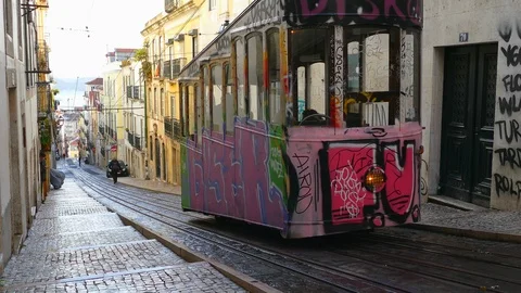 The ancient funicular carries passengers on the steep streets of central Lisbon Stock Footage 88262516