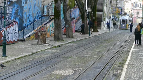The ancient funicular carries passengers on the steep streets of central Lisbon Stock Footage 88262871
