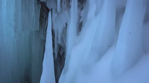 Ancient giant ice stalactites in underground cave. Winter Arctic North glaciers Stock Footage 317963489