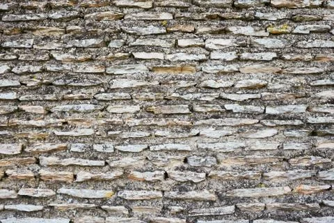 Ancient gray brick wall. Stock Photos