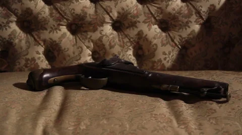 Ancient gun over old couch dolly Видео 61197785