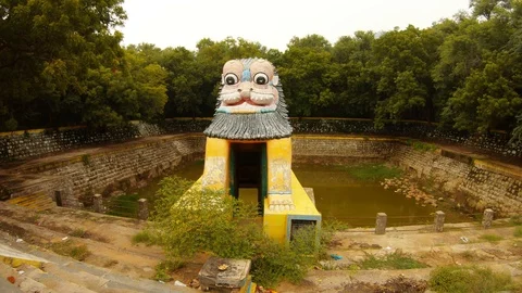 Ancient hand-made pond lion-shaped gate green jungle around Stock Footage 100408332