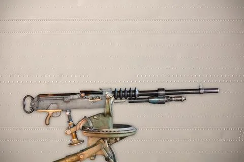 Ancient heavy machine gun in front of a steel background Stock Photos