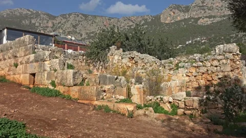 Ancient Hellenistic temple ruins against the Sleeping Man mountains Stock-Footage 343161118