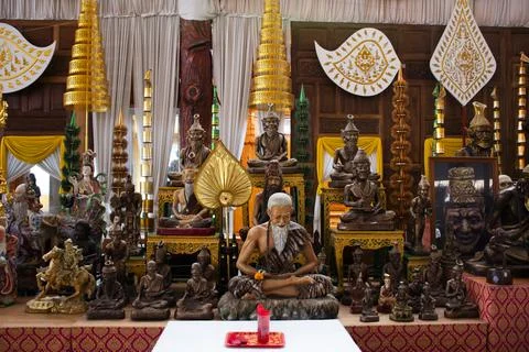 Ancient hermit or antique eremite statue with naka guardian of Wat Rat Prak.. Stock Photos