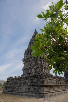 Ancient Hindu temple Prambanan complex with stone carvings and stupas under.. Stock Photos