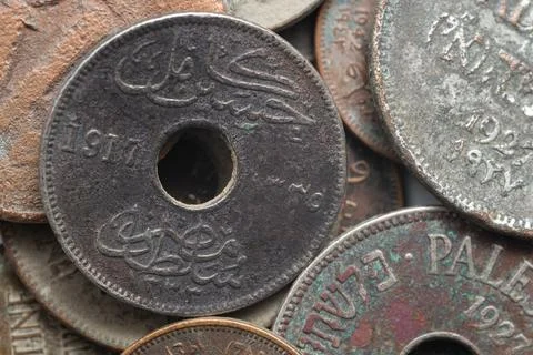 Ancient Holed Coin Dated 1917 with Arabic Script Stock Photos