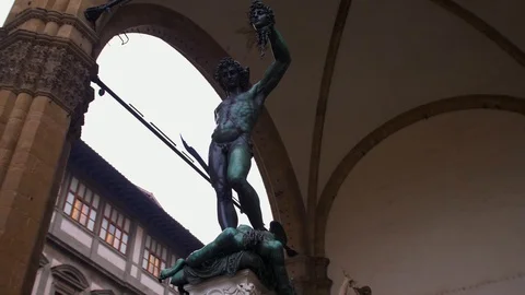 Ancient iron statue of a man with a dagger and head in whose hands he killed. Stock Footage 111282816
