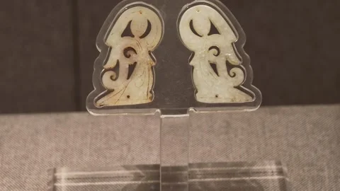 Ancient Jade Figurines Displayed on Clear Stand in Museum Case 스톡 동영상 340465875