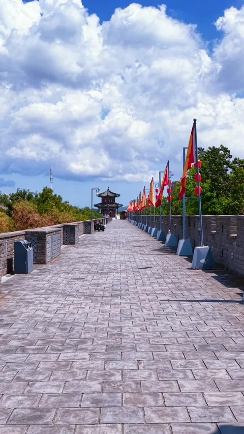 Ancient Jimo City Wall Lined with Festive Flags and Lanterns Stock Footage 330797245
