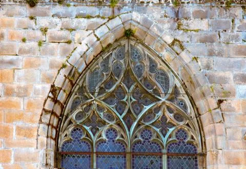 Ancient lanceolate window with stained glass, France Stock Photos