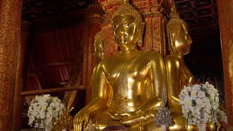 Ancient large gilded Buddhas inside Wat Phumin Temple Stock Footage 96729238