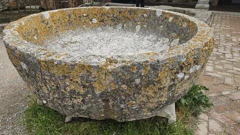 Ancient Lichen-Covered Stone Basin at Torcello Stock Photos