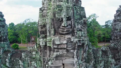 Ancient, lichen covered, stone face, carved from stone blocks Stock Footage 63418196