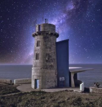 An ancient lighthouse under the starlight 스톡 사진