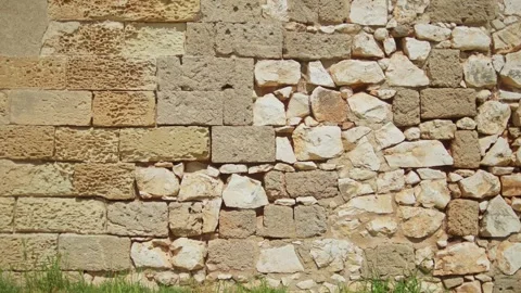 Ancient limestone and masonry wall of Swabian Castle in Brindisi Italy Stock Footage 338404307