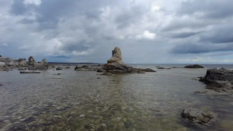 Ancient Limestone Rauk in Shallow Clear Baltic Sea Gotland Sweden Stock Footage 344684311