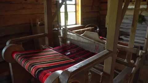 Ancient loom inside an old hut, a knitting and spinning machine. An old Video stock 244810405