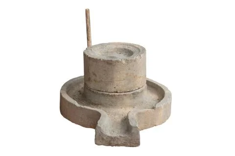 Ancient manual stone mill isolated. Stock Photos