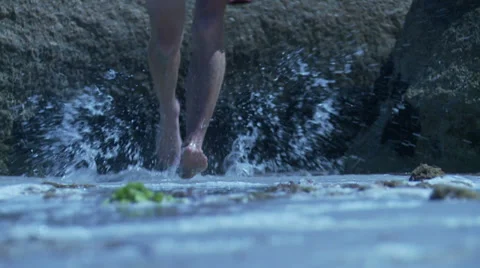 Ancient marathon runner running through water Stock Footage 36051263