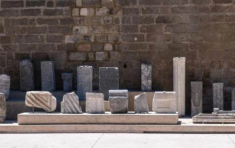 Ancient Marble Columns and Artifacts Displayed in Old Town Rhodes Stock Photos