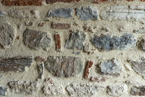 Ancient masonry. An old stone wall. Ancient texture. Close-up photos of high  Stock Photos